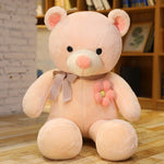 ours en peluche rose fleur